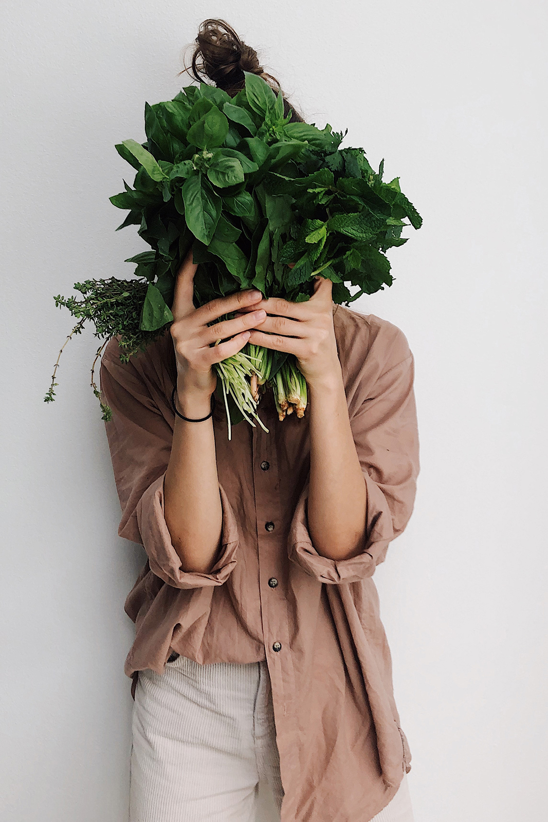 Woman Holding Plants | Chew & Lush